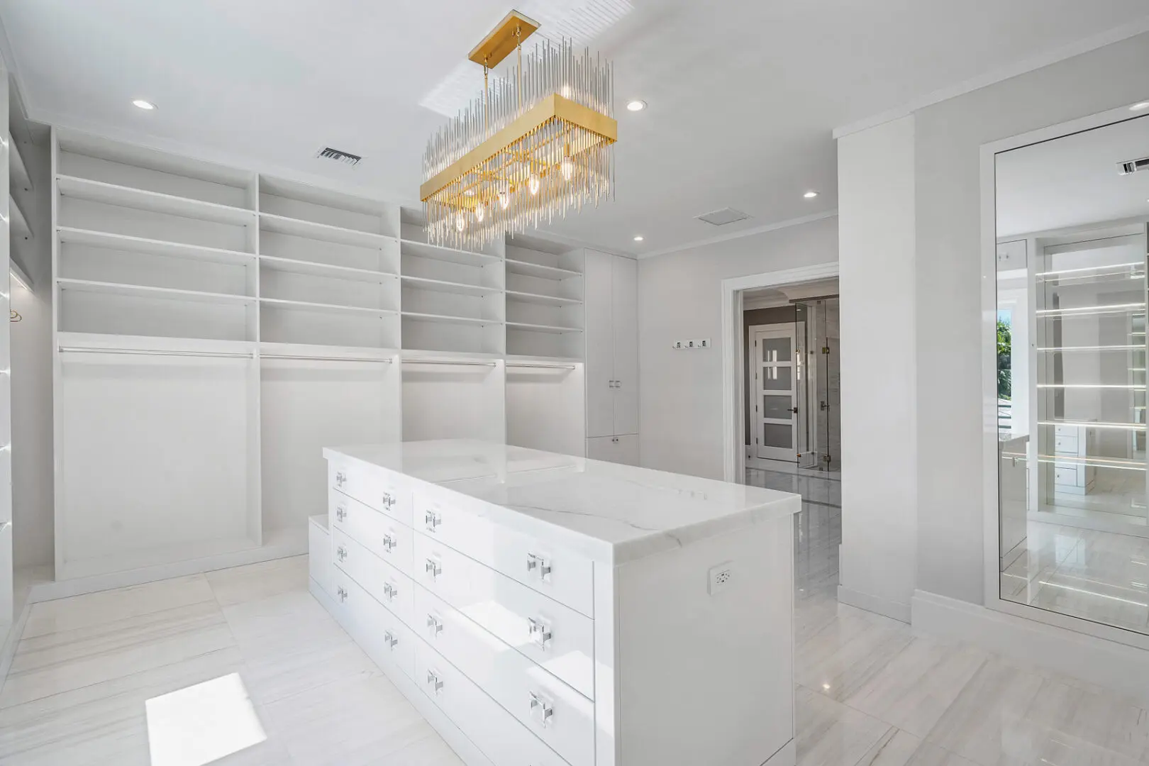 A large white room with a big dresser