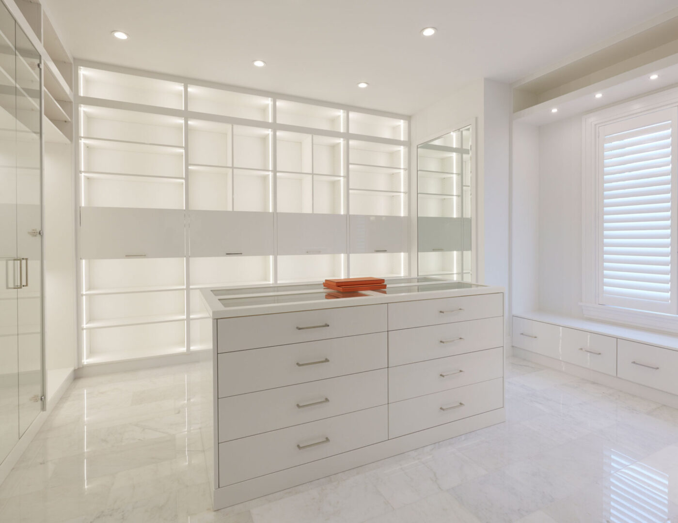 A white room with many drawers and shelves.