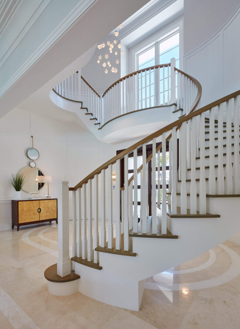 A staircase with white and brown railing in the middle of it.