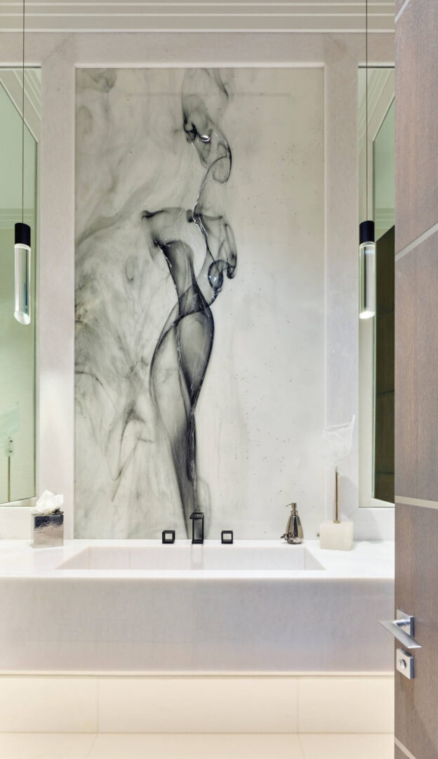 A bathroom with a large wall mural of a woman.