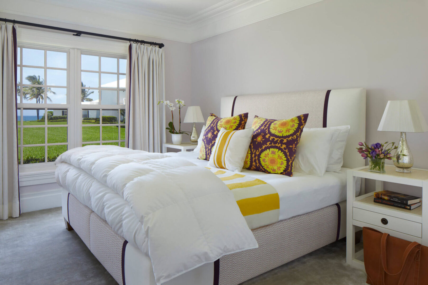 A bedroom with white walls and yellow accents.