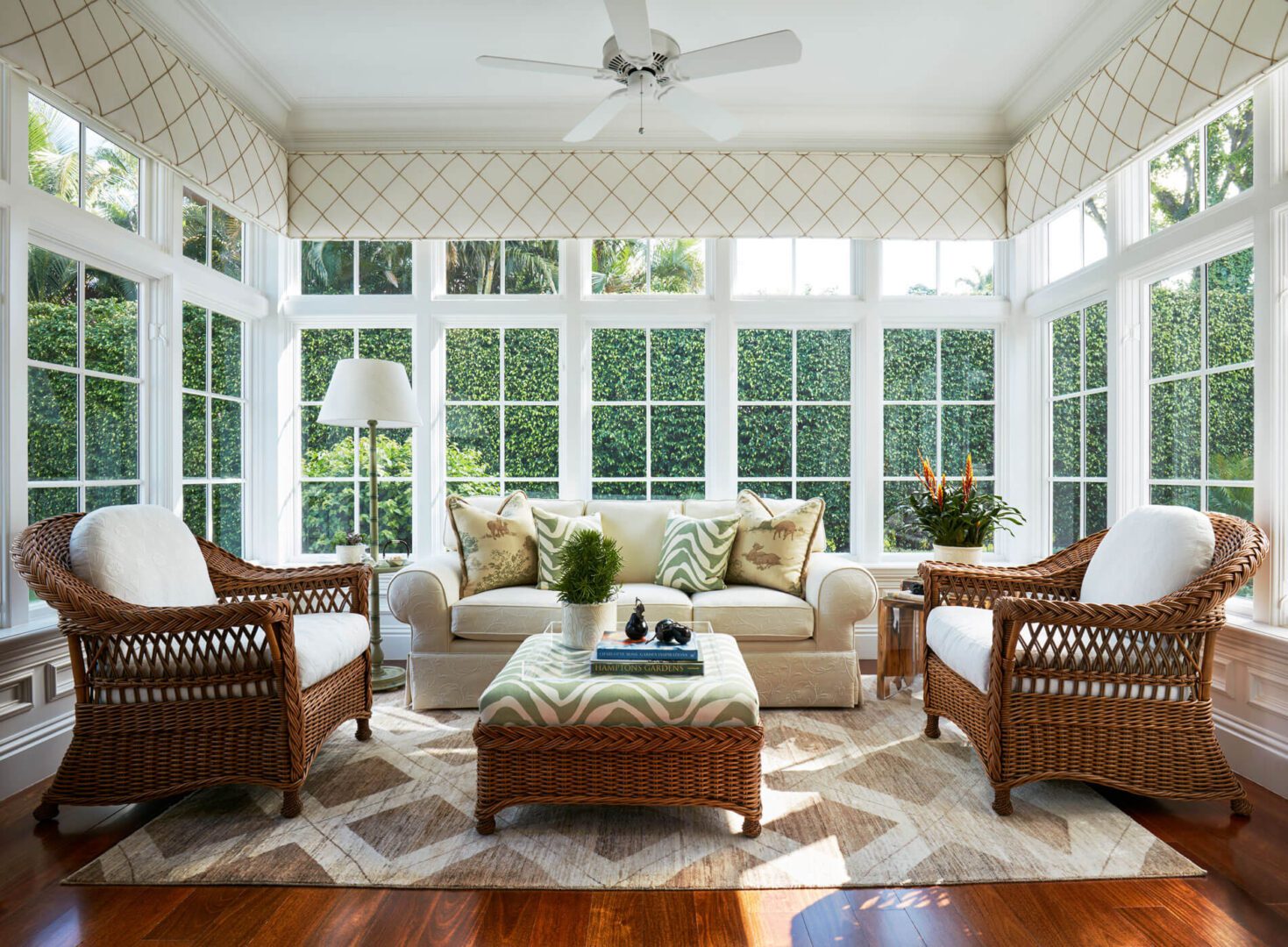 A living room with four chairs and two couches.