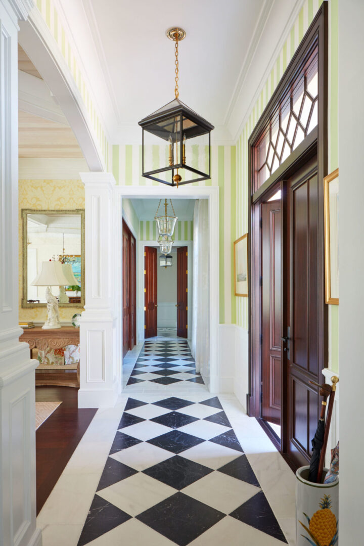 A hallway with black and white checkered floor