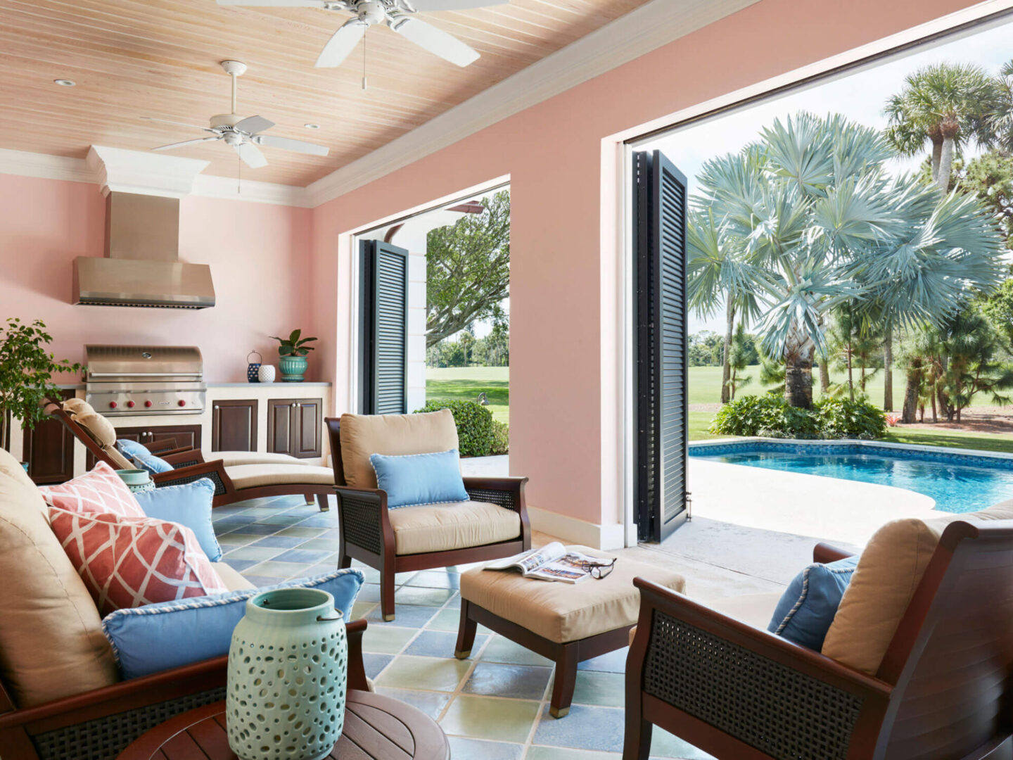 A living room with pink walls and a pool.