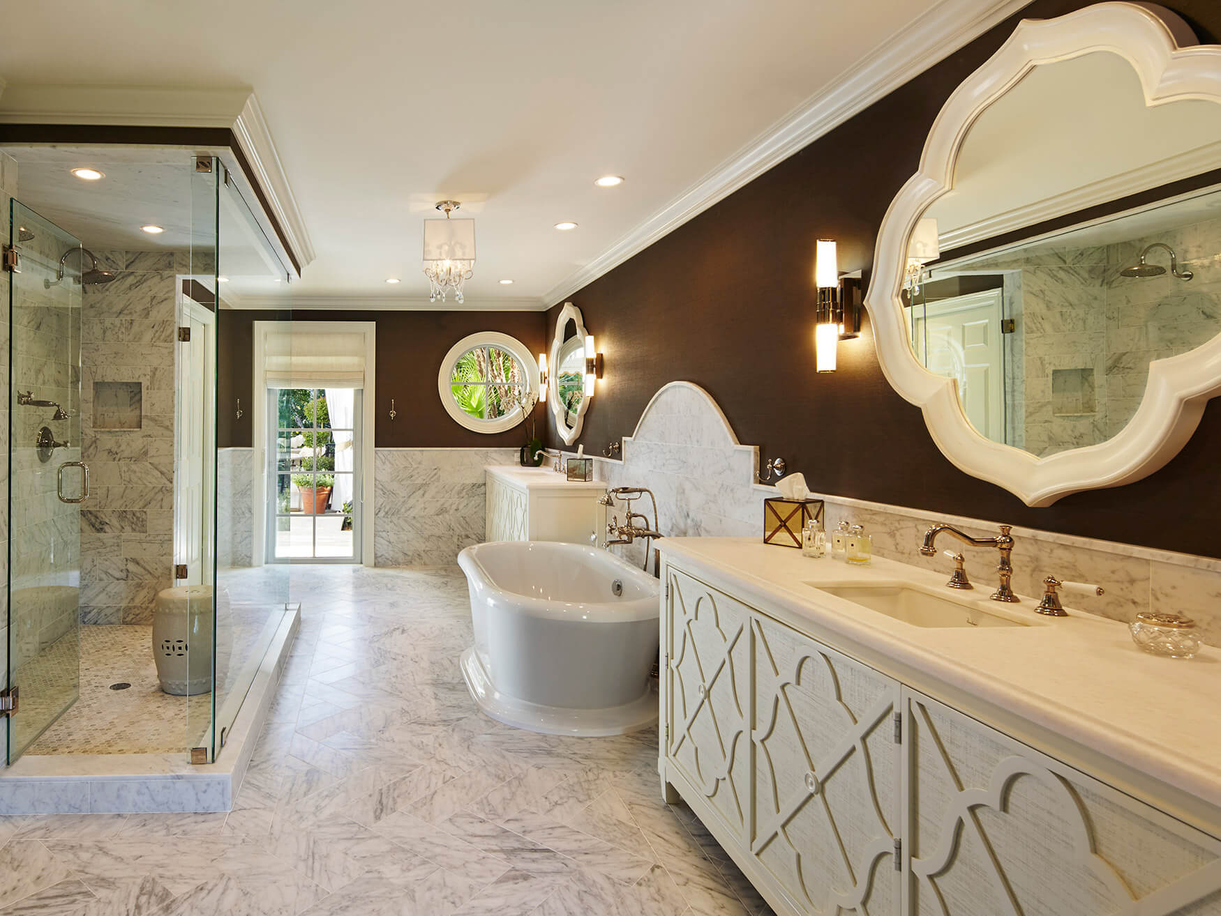 A bathroom with a large mirror and a white sink.