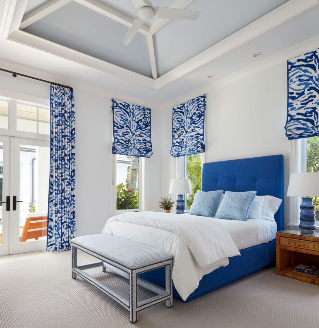 A bedroom with blue and white decor is shown.