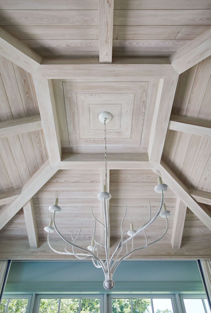 A chandelier hanging from the ceiling of a room.