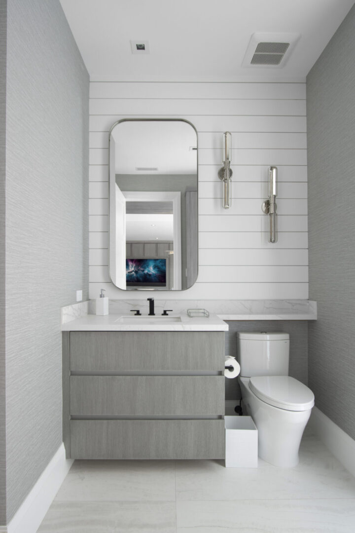 Modern gray bathroom with white shiplap.