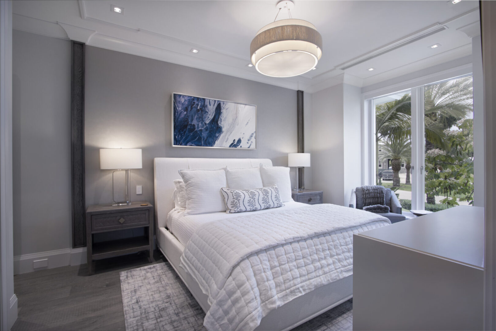 White bed in a modern bedroom.